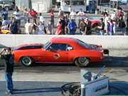 ORANGE 1969 CAMARO WITH BLACK STRIPES